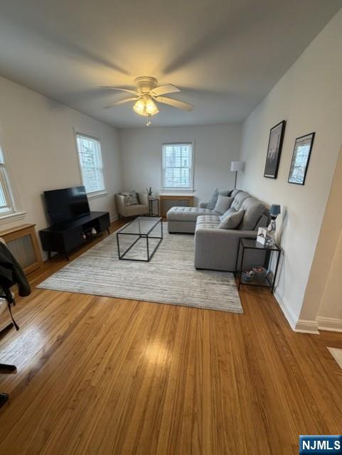 2-8 New Street, Unit 8A Tenafly, NJ 07670 - Photo 6 of 29 a living room with furniture and a wooden floor