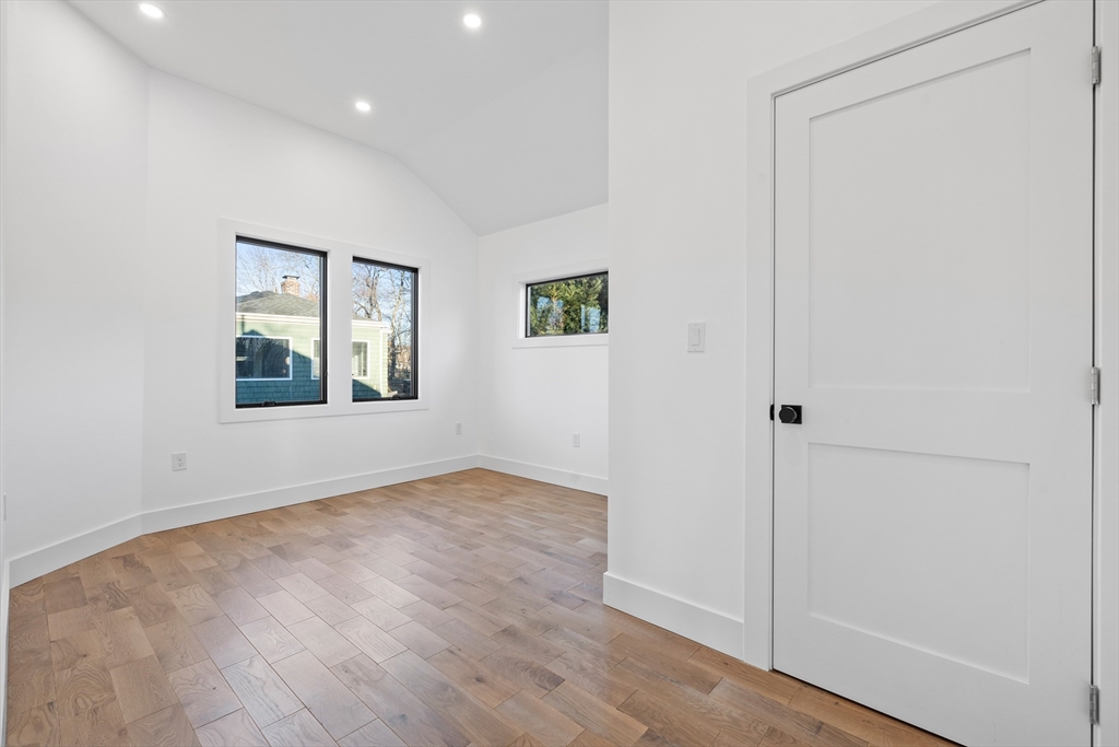 1 Knollwood Road Marblehead, MA 01945 - Photo 12 of 24 an empty room with wooden floor and windows