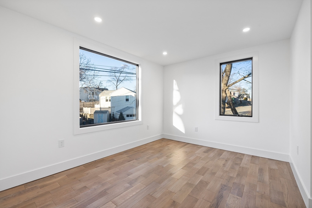 1 Knollwood Road Marblehead, MA 01945 - Photo 14 of 24 an empty room with wooden floor and windows