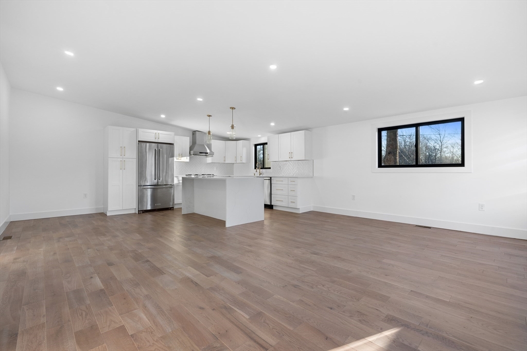 1 Knollwood Road Marblehead, MA 01945 - Photo 7 of 24 a view of a kitchen with a sink and a refrigerator