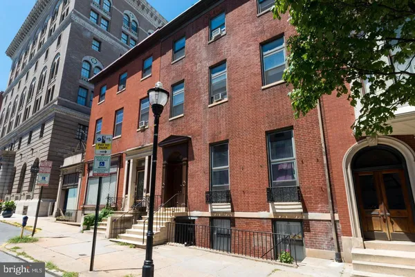 a front view of a building with street view