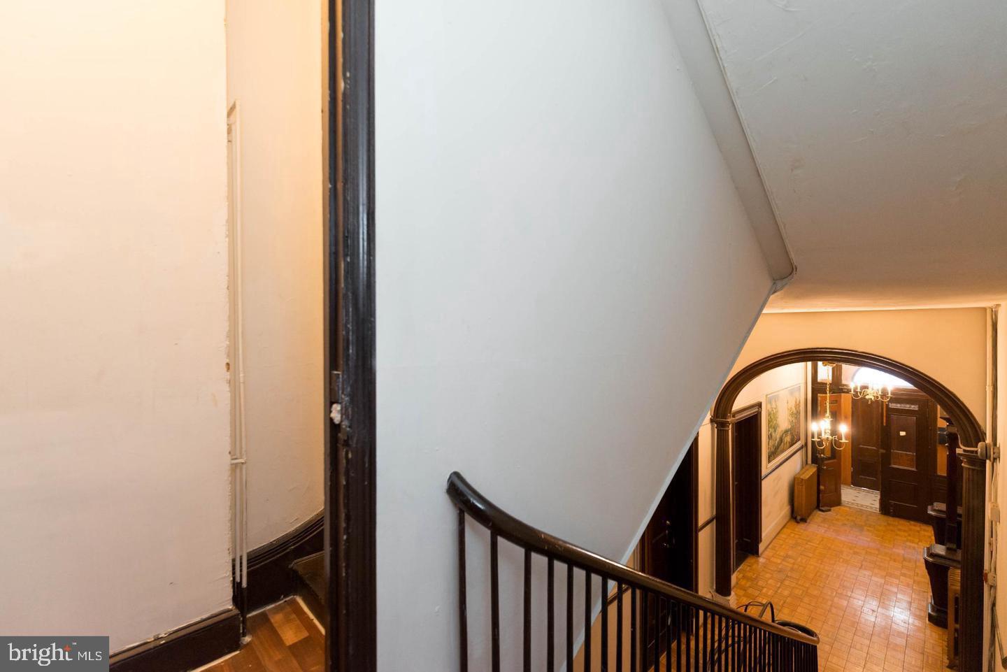 18 West Franklin Street Baltimore, MD 21201 - Photo 20 of 58 a view of staircase with railing and white walls