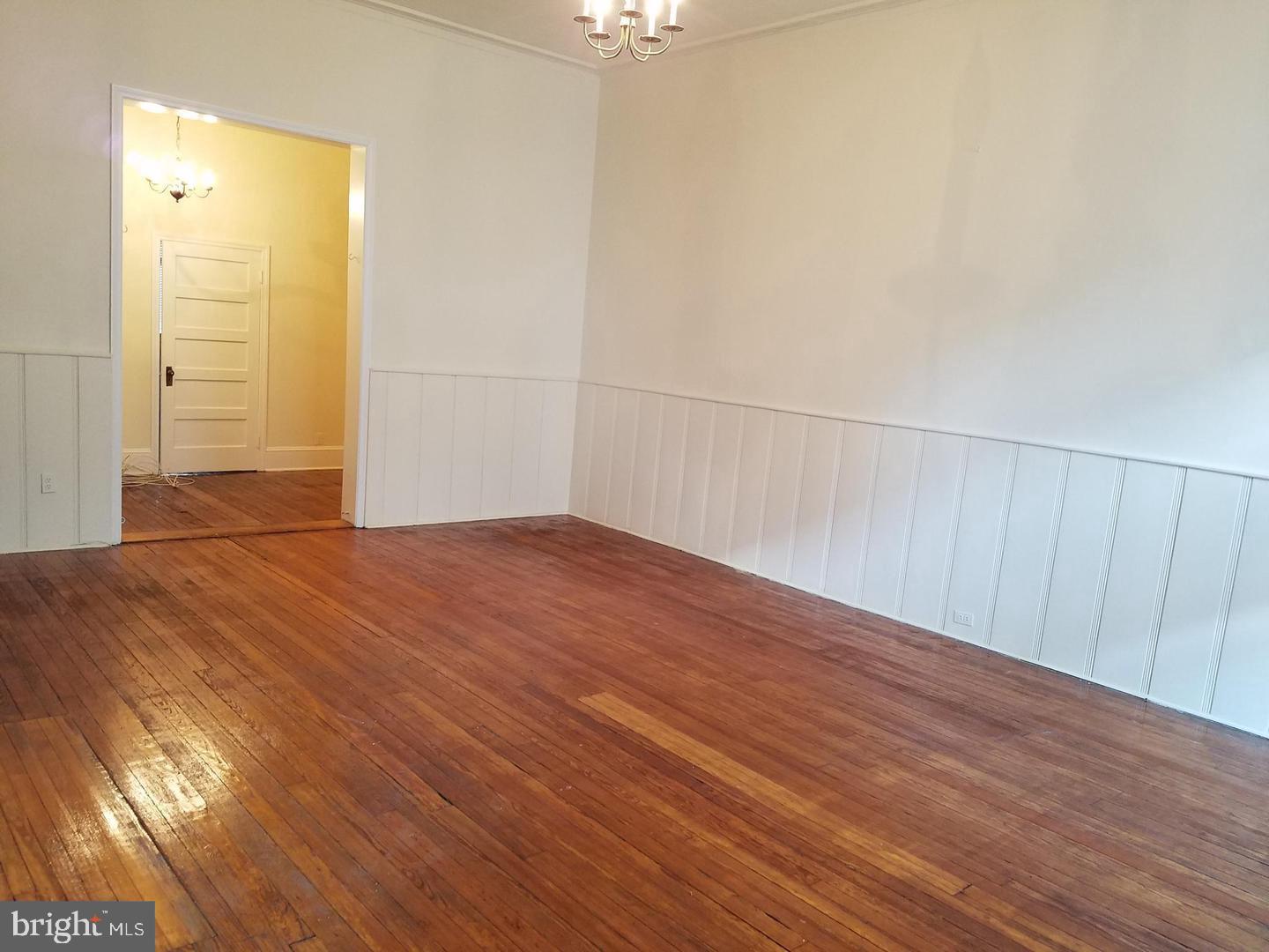 18 West Franklin Street Baltimore, MD 21201 - Photo 23 of 58 a view of empty room with wooden floor