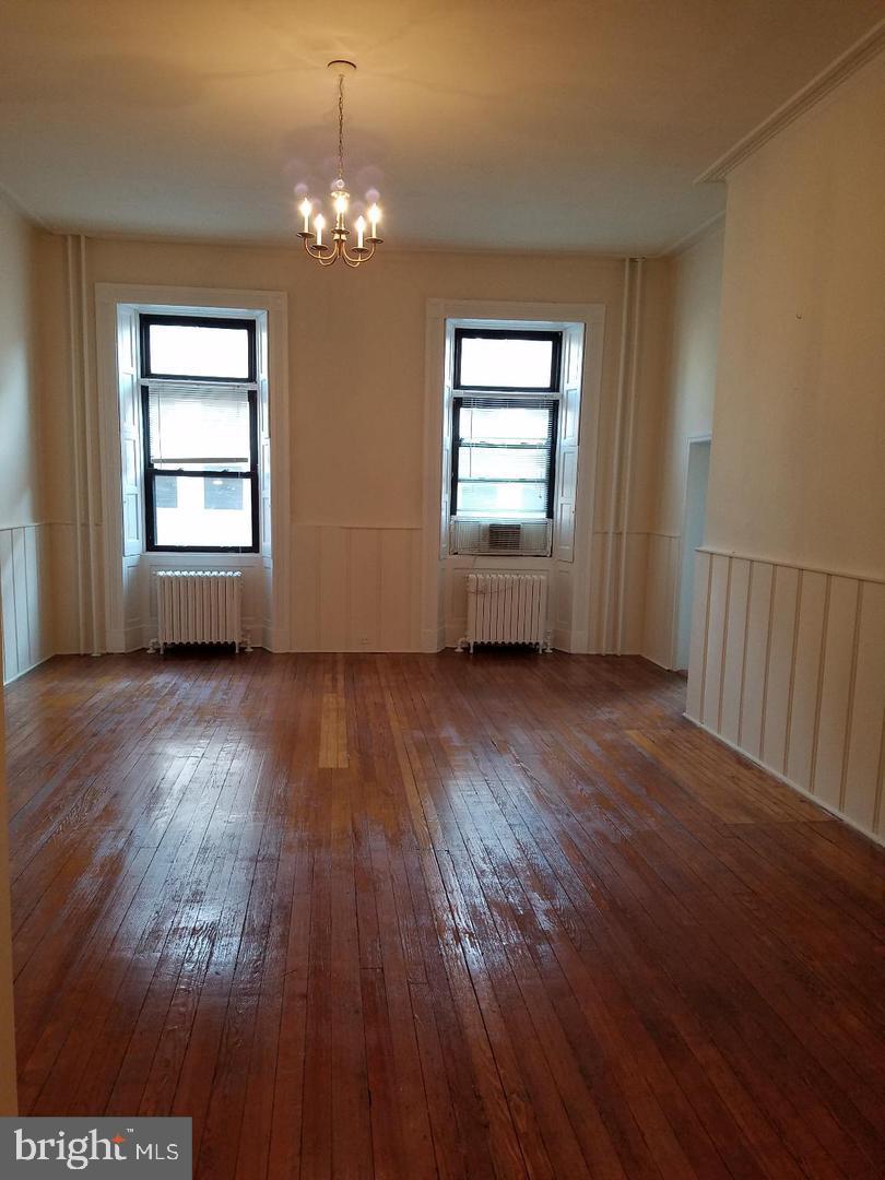 18 West Franklin Street Baltimore, MD 21201 - Photo 24 of 58 a view of livingroom with hardwood floor and window