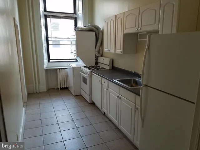a view of a bathroom from a hallway