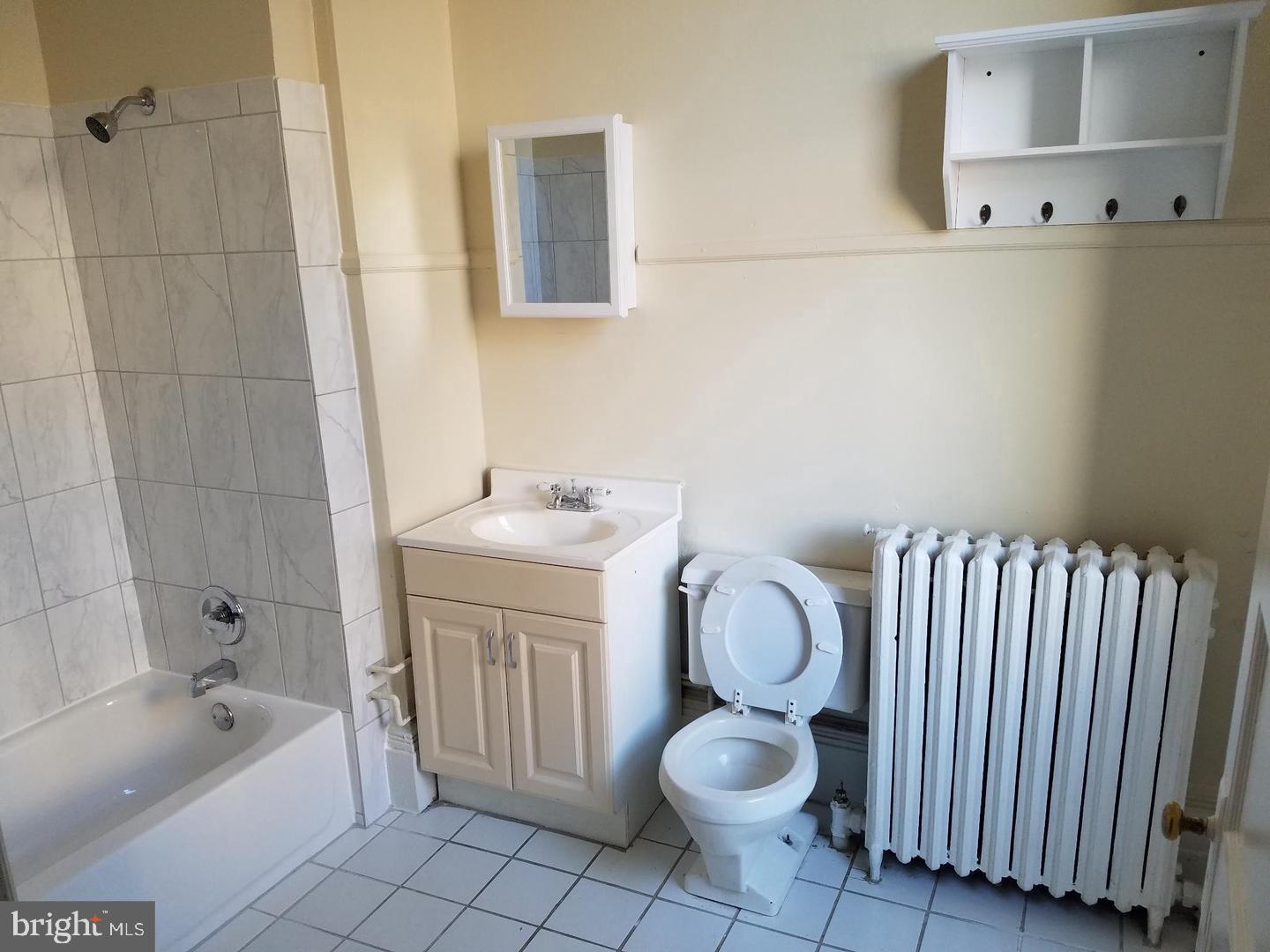 18 West Franklin Street Baltimore, MD 21201 - Photo 28 of 58 a bathroom with a sink toilet and shower