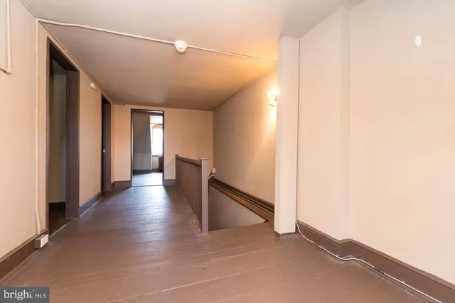 a kitchen with stainless steel appliances a stove a sink and a refrigerator