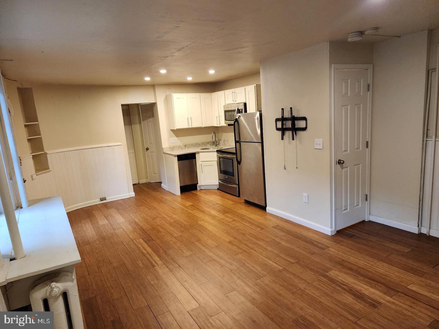 18 West Franklin Street Baltimore, MD 21201 - Photo 53 of 58 a view of a kitchen with a sink and a refrigerator