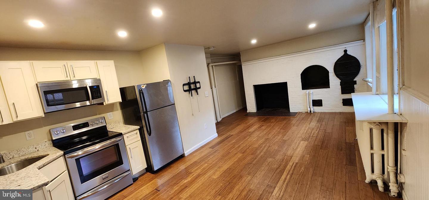 18 West Franklin Street Baltimore, MD 21201 - Photo 55 of 58 a view of a kitchen with wooden floor