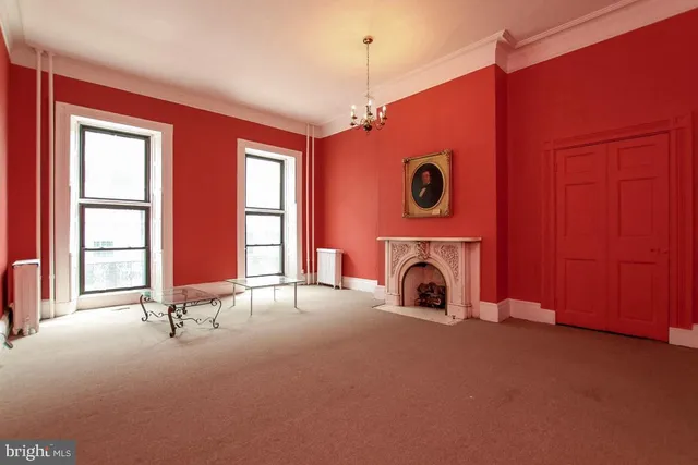 a bathroom with a toilet sink vanity and mirror