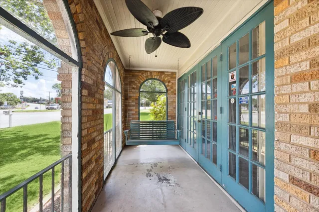 a view of lobby with a floor to ceiling window and wooden floor