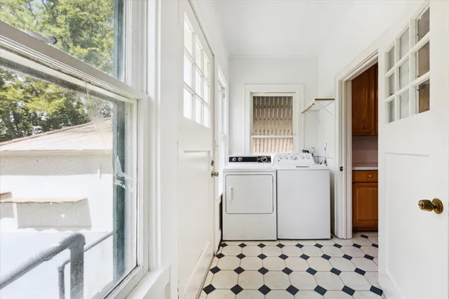 a bathroom with a sink a mirror with window
