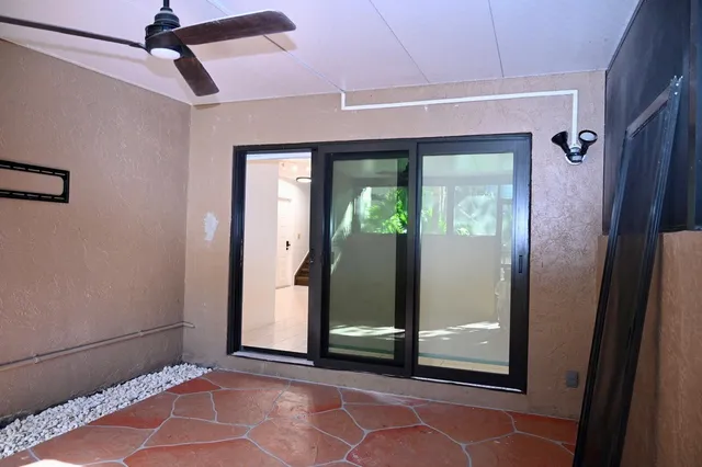 a view of a room that has a large mirror and a glass door shower
