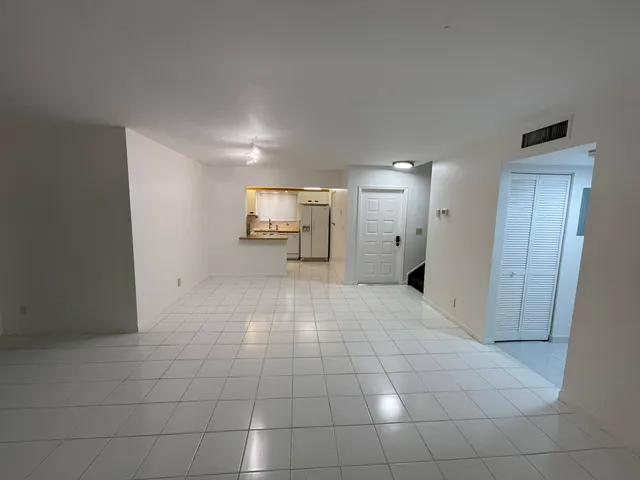 a view of a livingroom with a dinning table and chair