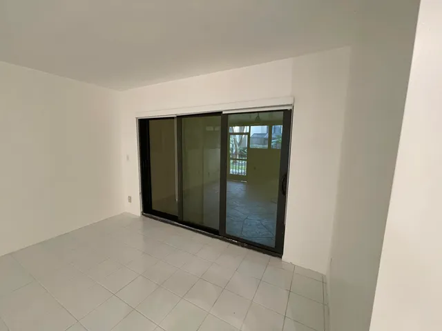 an empty room with mirror