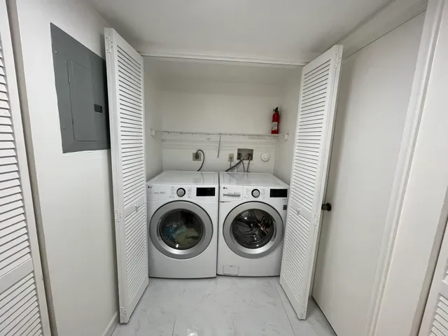 a utility room with dryer and washer