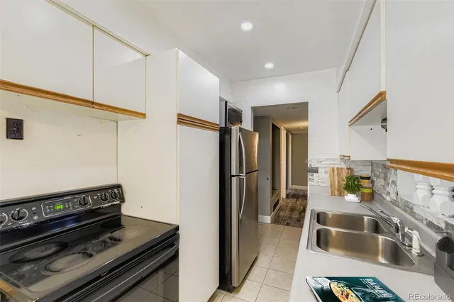 a kitchen with a stove and a refrigerator