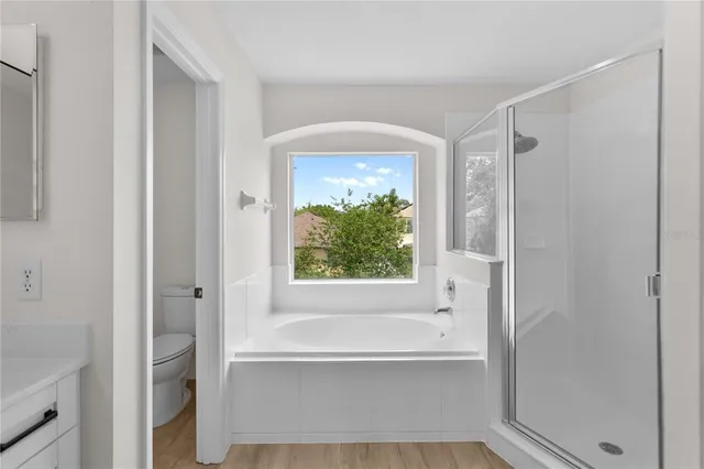 a bathroom with a bathtub and a shower