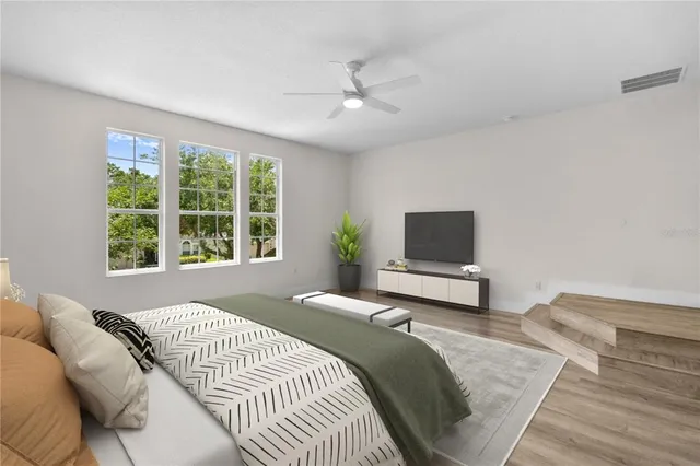 a bedroom with a bed and a window