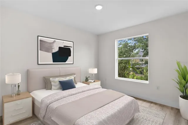 a bedroom with a bed and a window