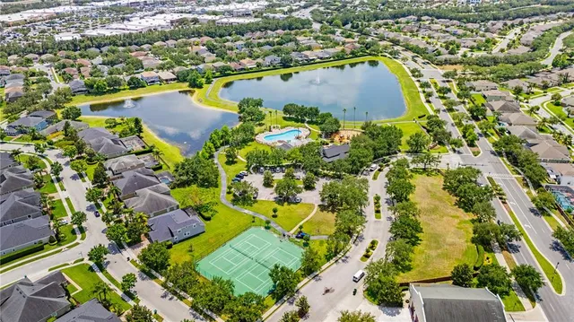 an aerial view of residential houses with outdoor space