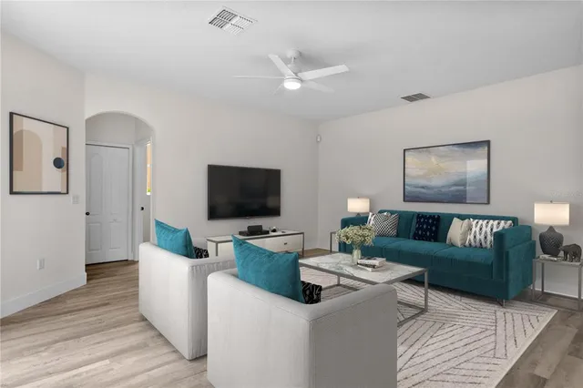 a living room with furniture and a flat screen tv