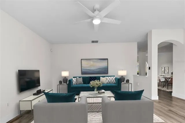 a living room with furniture and a flat screen tv