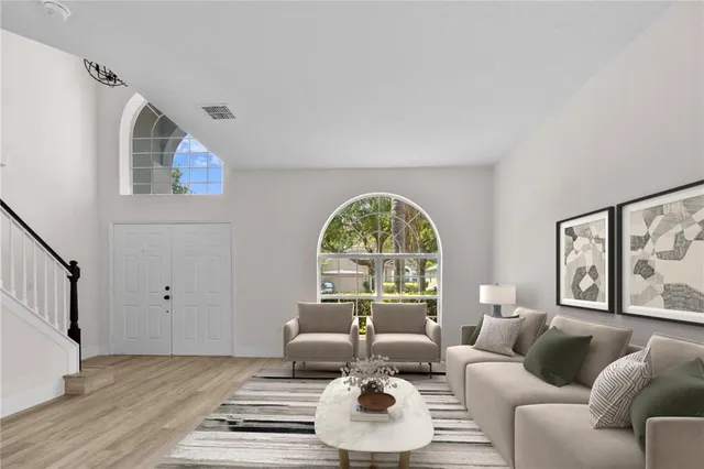 a living room with furniture and a large window
