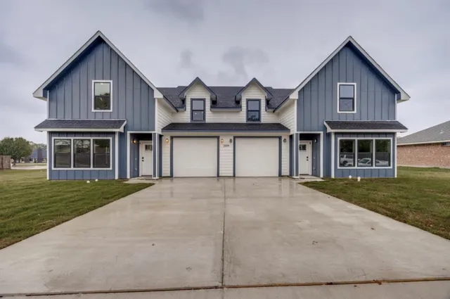 a view of a yard in front of a house with a yard
