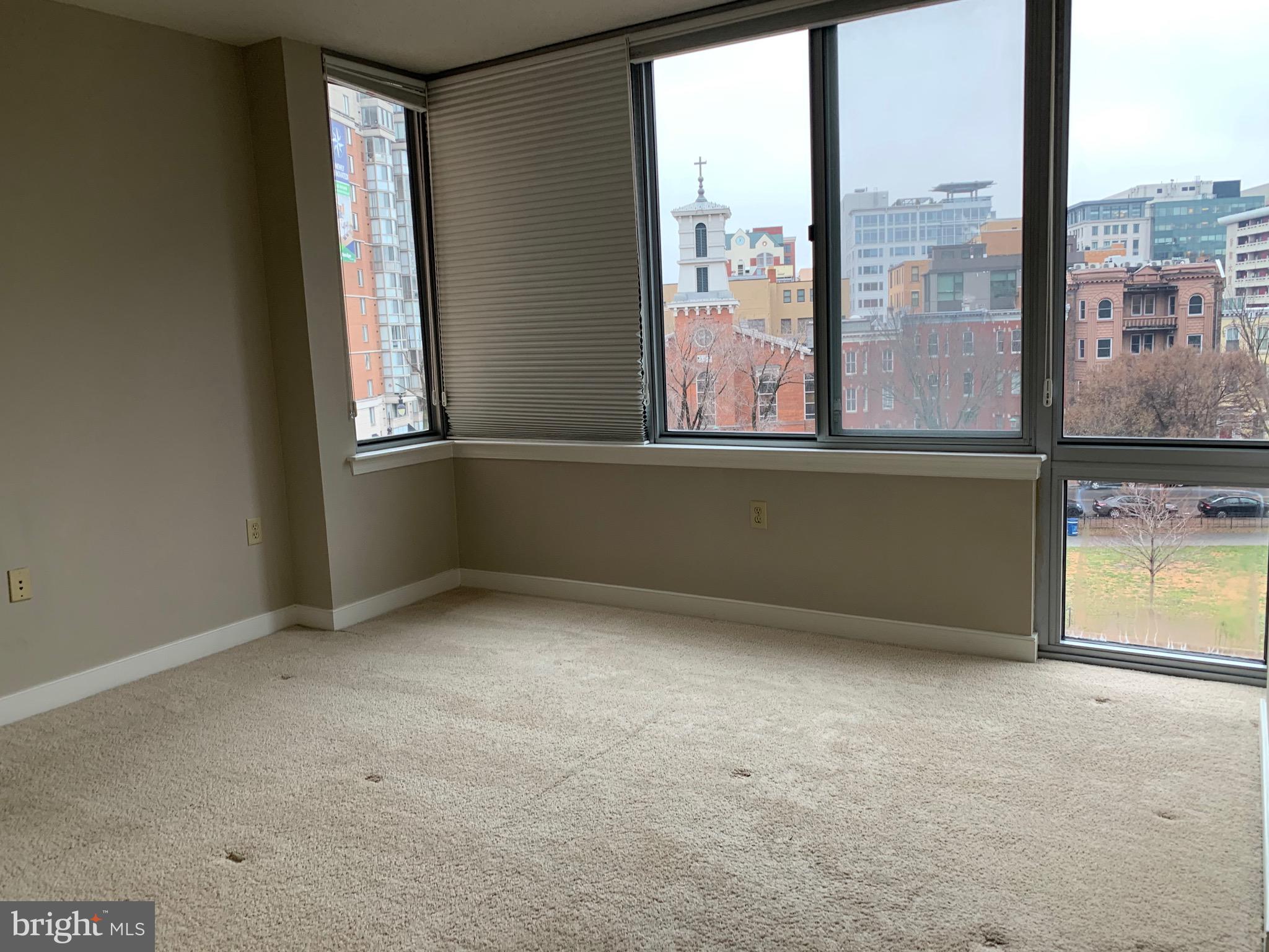 555 Massachusetts Avenue Northwest, Unit 503 Washington, DC 20001 - Photo 11 of 24 an empty room with a window