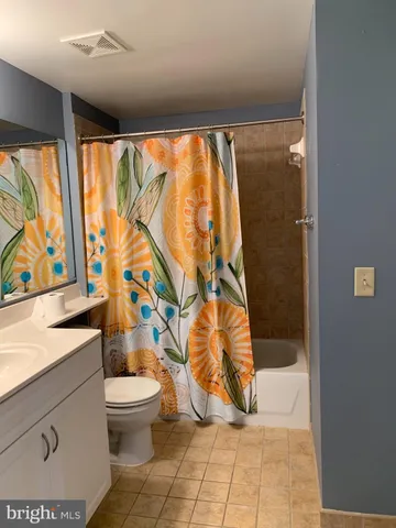 a bathroom with a bathtub and toilet