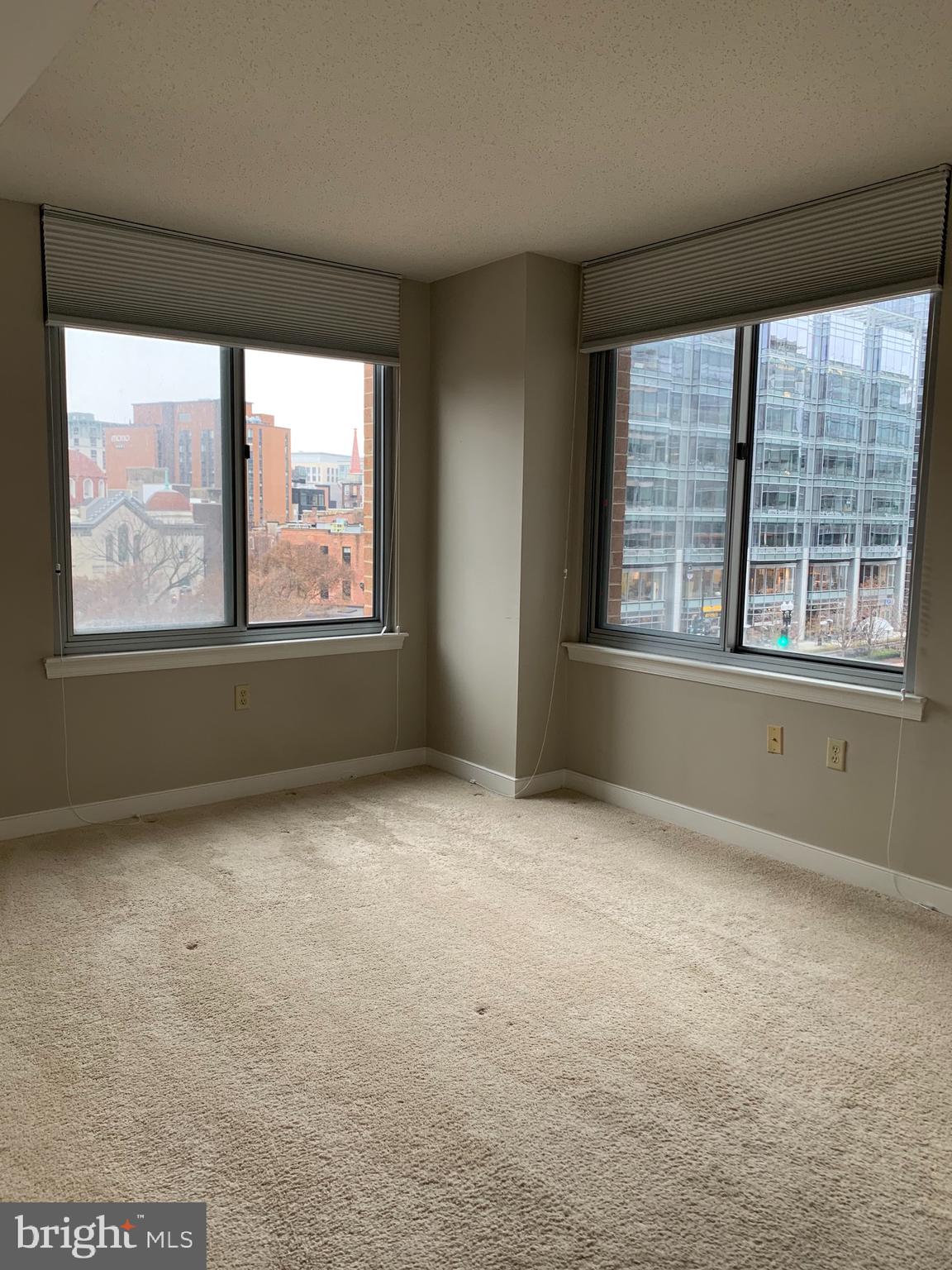 555 Massachusetts Avenue Northwest, Unit 503 Washington, DC 20001 - Photo 13 of 24 an empty room with a window