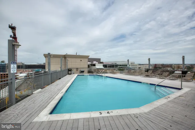 a view of a swimming pool with a lounge chair