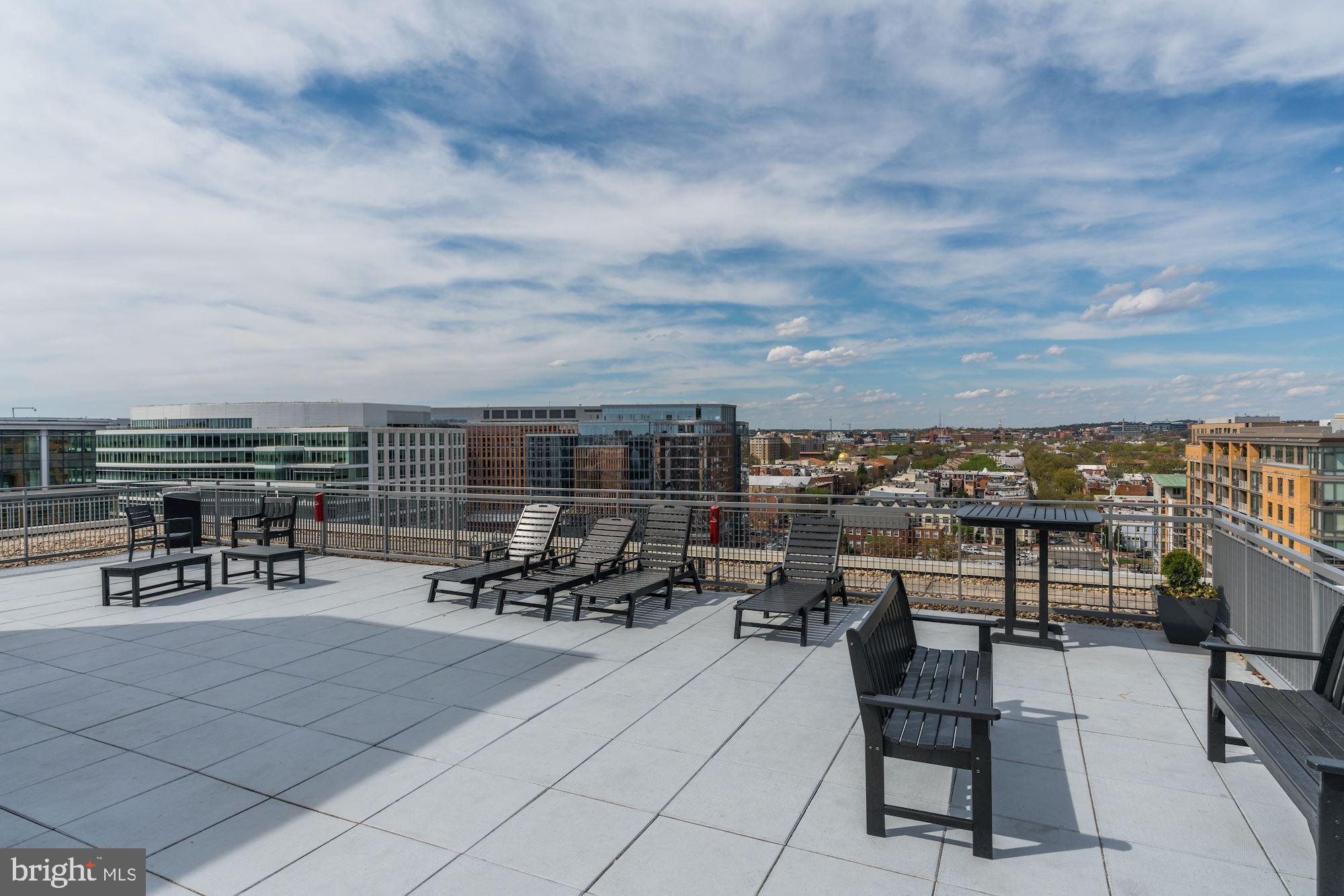 555 Massachusetts Avenue Northwest, Unit 503 Washington, DC 20001 - Photo 21 of 24 a view of a terrace with seating area