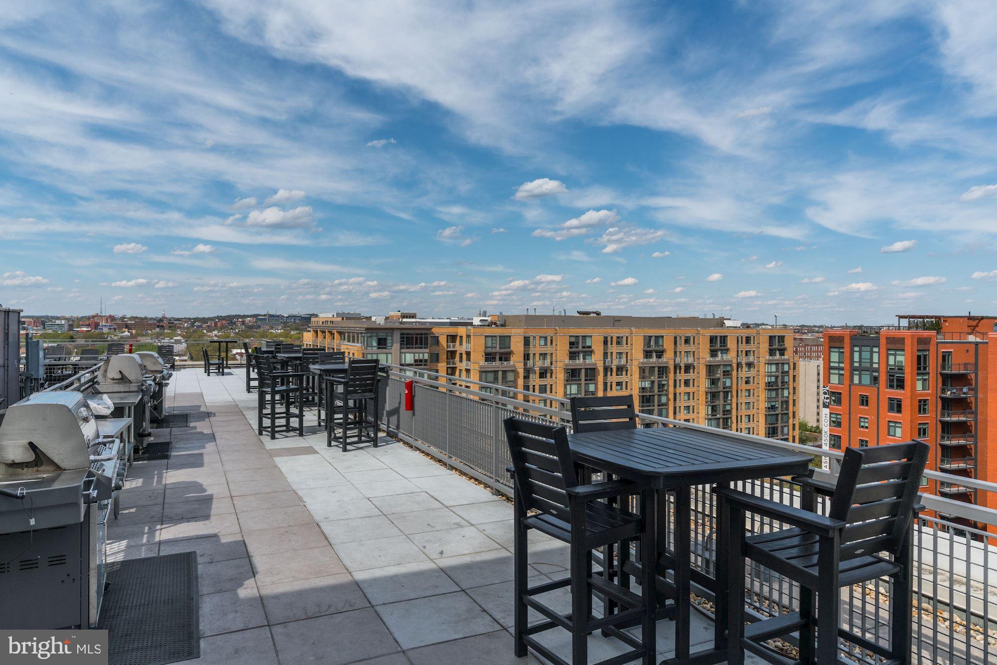 555 Massachusetts Avenue Northwest, Unit 503 Washington, DC 20001 - Photo 22 of 24 a view of a balcony with chairs and a table