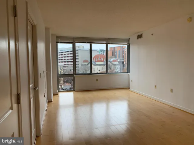 a view of hallway with wooden floor