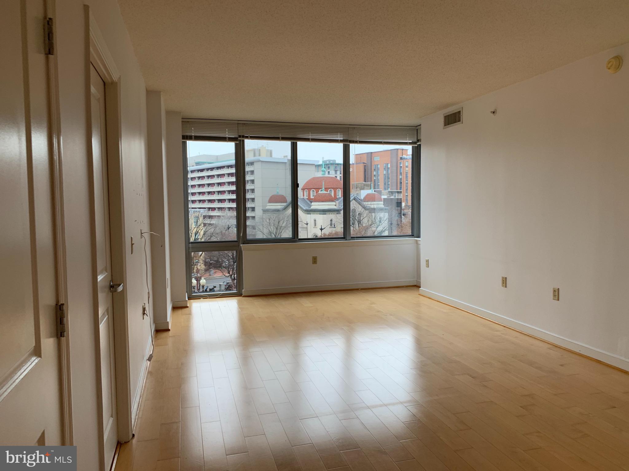 555 Massachusetts Avenue Northwest, Unit 503 Washington, DC 20001 - Photo 3 of 24 a view of hallway with wooden floor