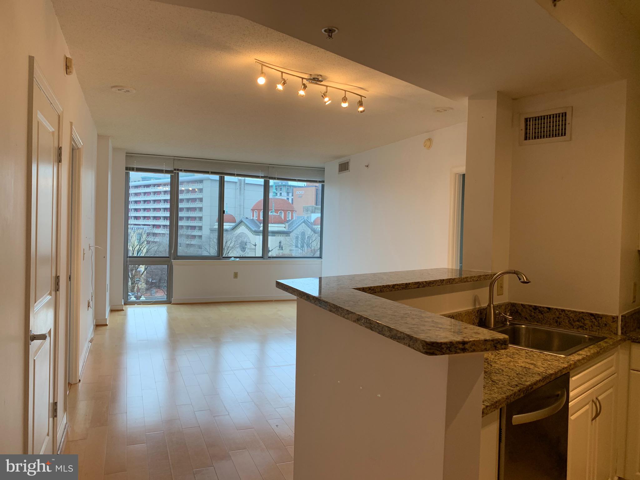 555 Massachusetts Avenue Northwest, Unit 503 Washington, DC 20001 - Photo 5 of 24 a kitchen with a sink and a stove