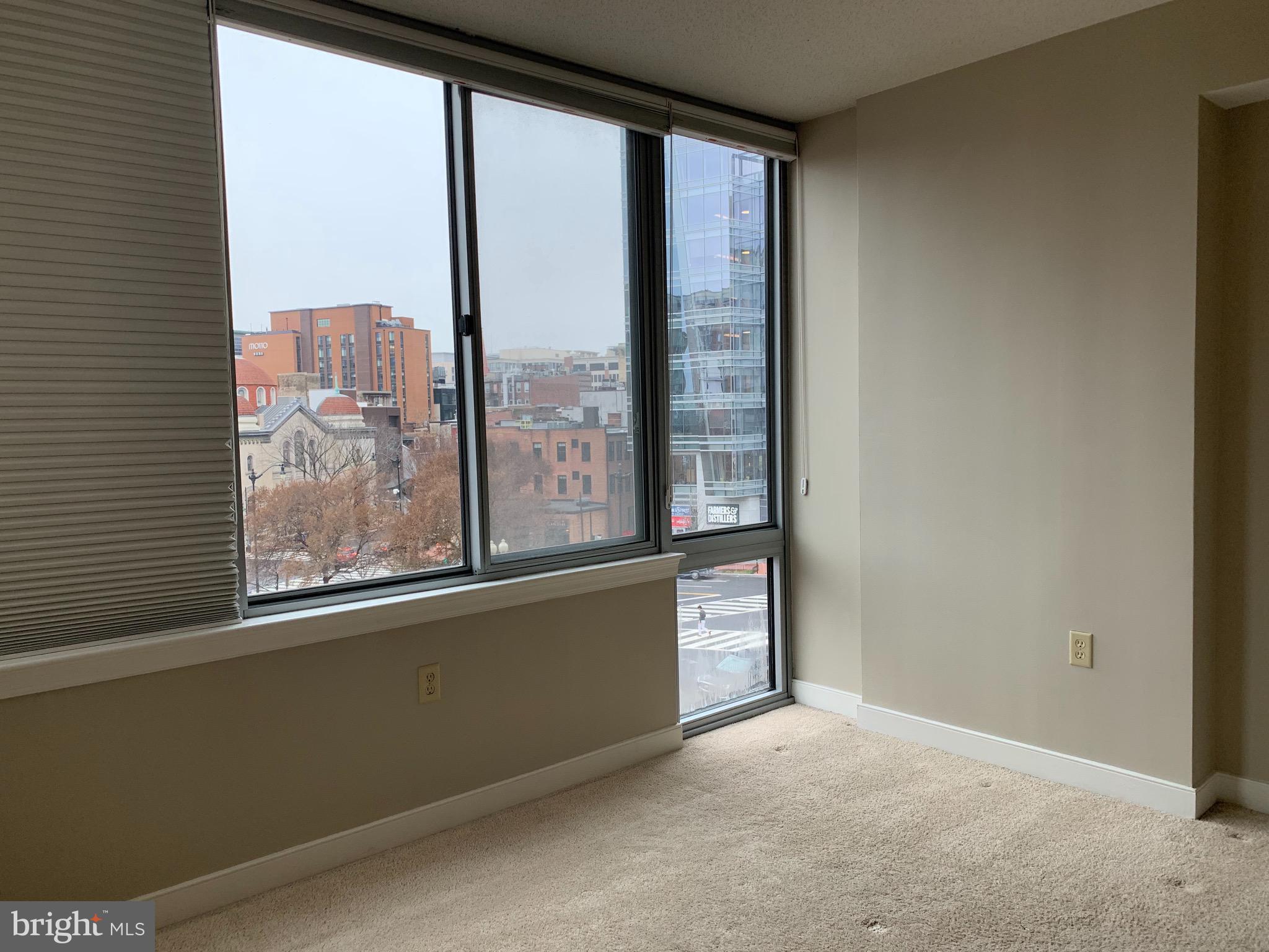 555 Massachusetts Avenue Northwest, Unit 503 Washington, DC 20001 - Photo 9 of 24 a view of a room with a large window