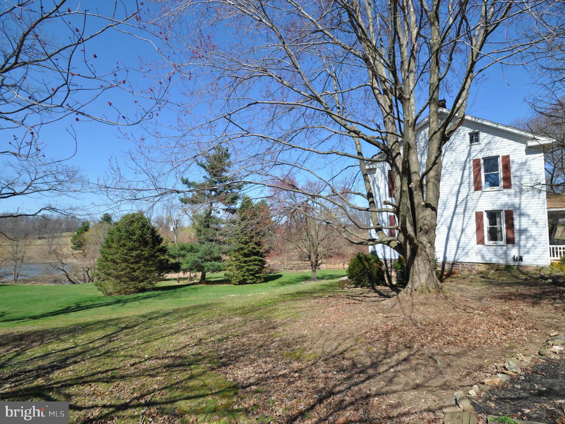 1206 Stone Road Westminster, MD 21158 - Photo 4 of 27 SIDE OF HOME WITH VIEW OF 1 ACRE POND