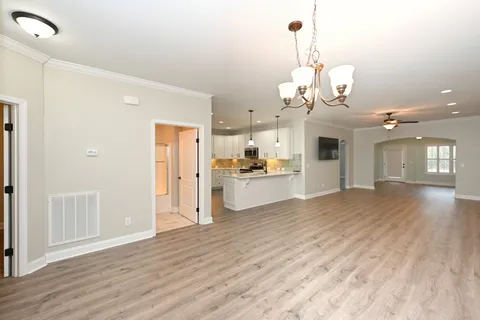 a view of a kitchen counter space and wooden floor