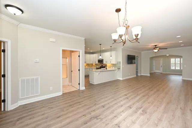 a view of a kitchen counter space and wooden floor