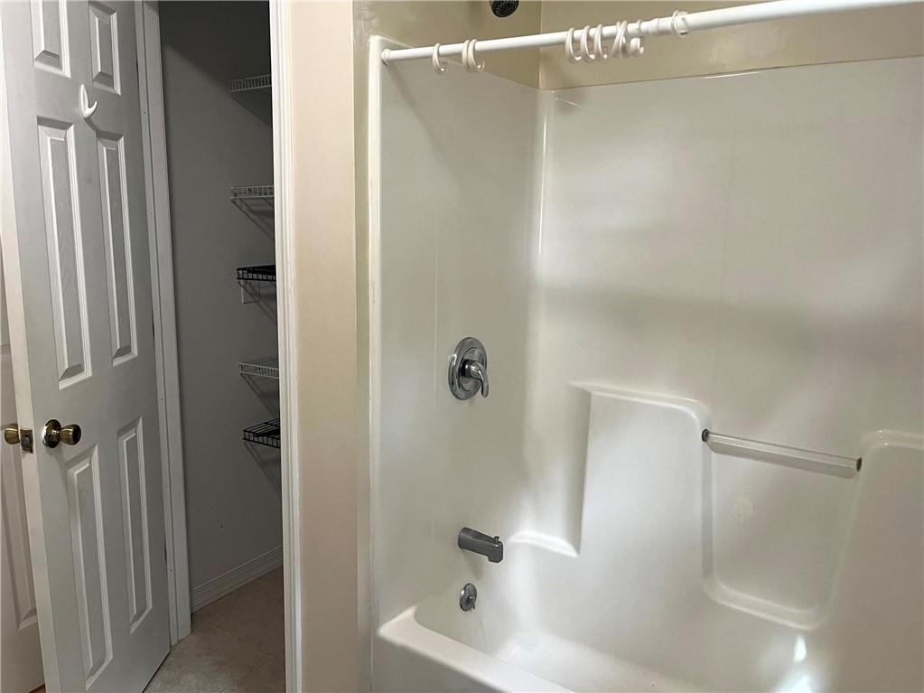 75 Cave Street Fairchance, PA 15436 - Photo 17 of 36 a bathroom with a tub and a shower