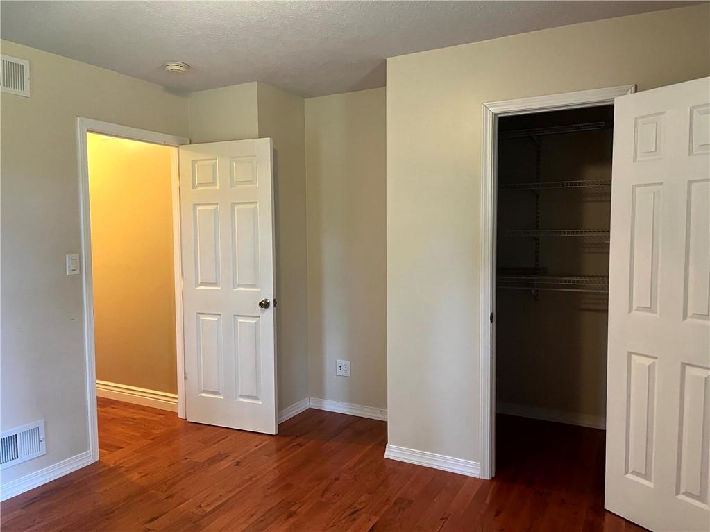 75 Cave Street Fairchance, PA 15436 - Photo 18 of 36 an empty room with wooden floor & closet