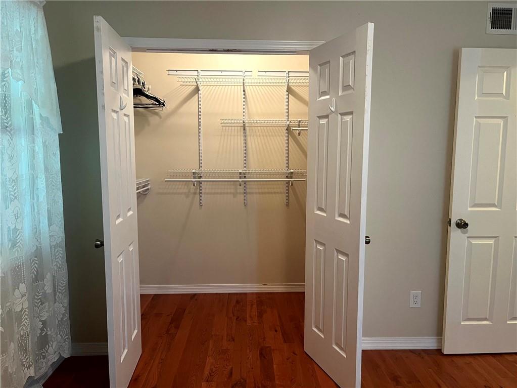 75 Cave Street Fairchance, PA 15436 - Photo 23 of 36 a view of walk in closet with wooden floor