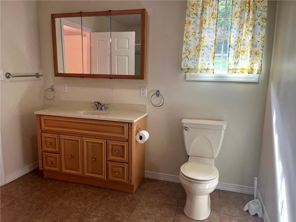 75 Cave Street Fairchance, PA 15436 - Photo 25 of 36 a bathroom with a toilet sink and mirror