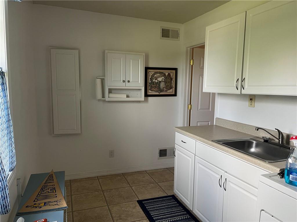 75 Cave Street Fairchance, PA 15436 - Photo 27 of 36 a kitchen with a sink and cabinets