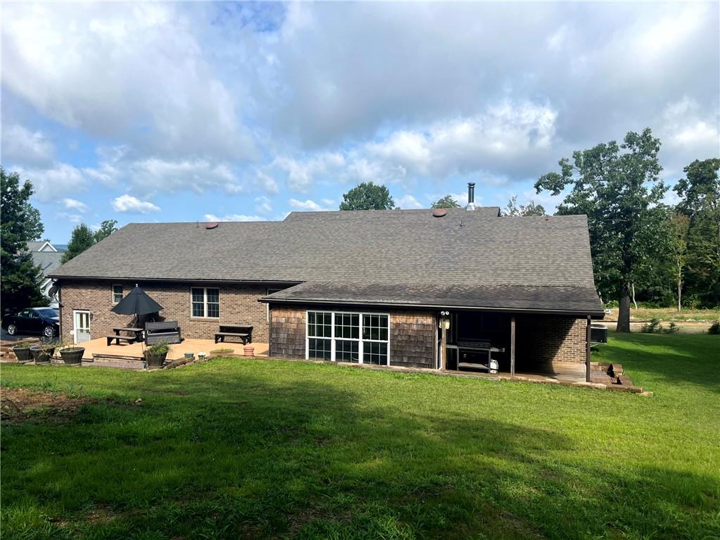75 Cave Street Fairchance, PA 15436 - Photo 30 of 36 a front view of a house with a garden and trees