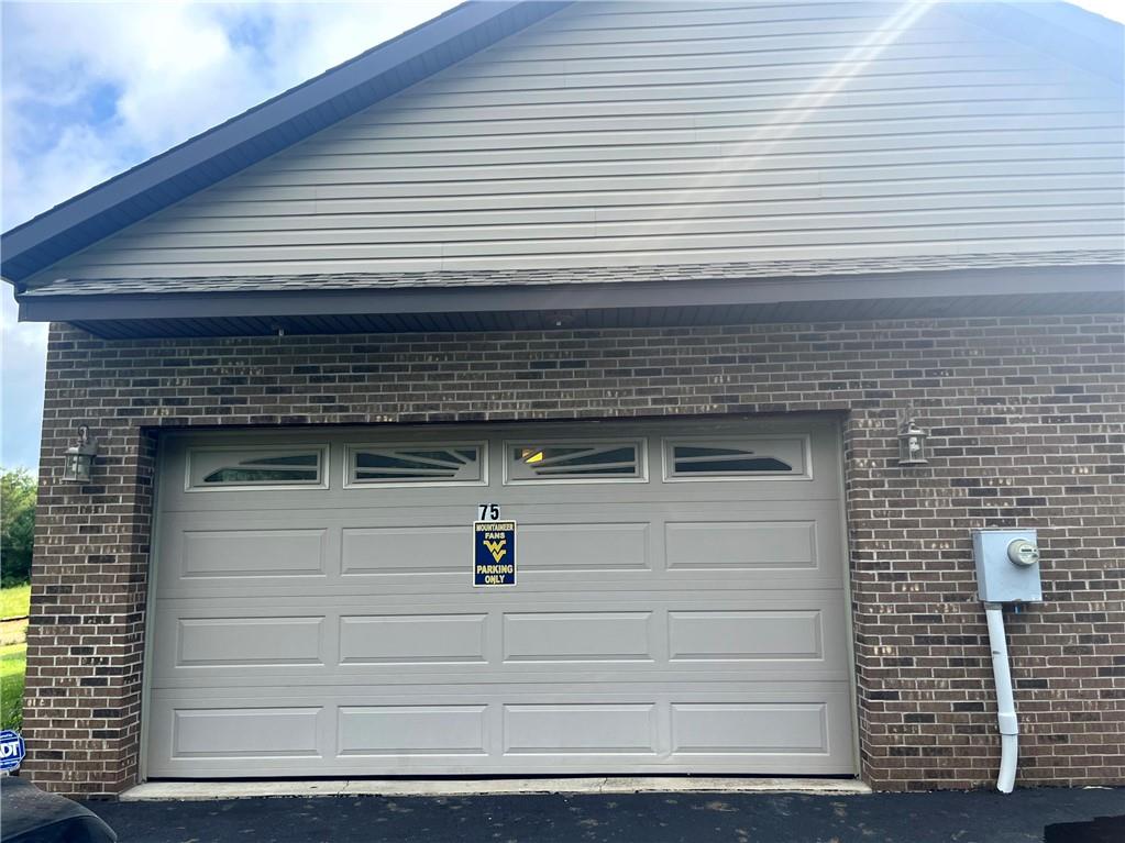 75 Cave Street Fairchance, PA 15436 - Photo 34 of 36 a front view of a house with a yard