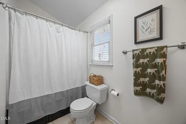 a bathroom with double vanity sink and a mirror